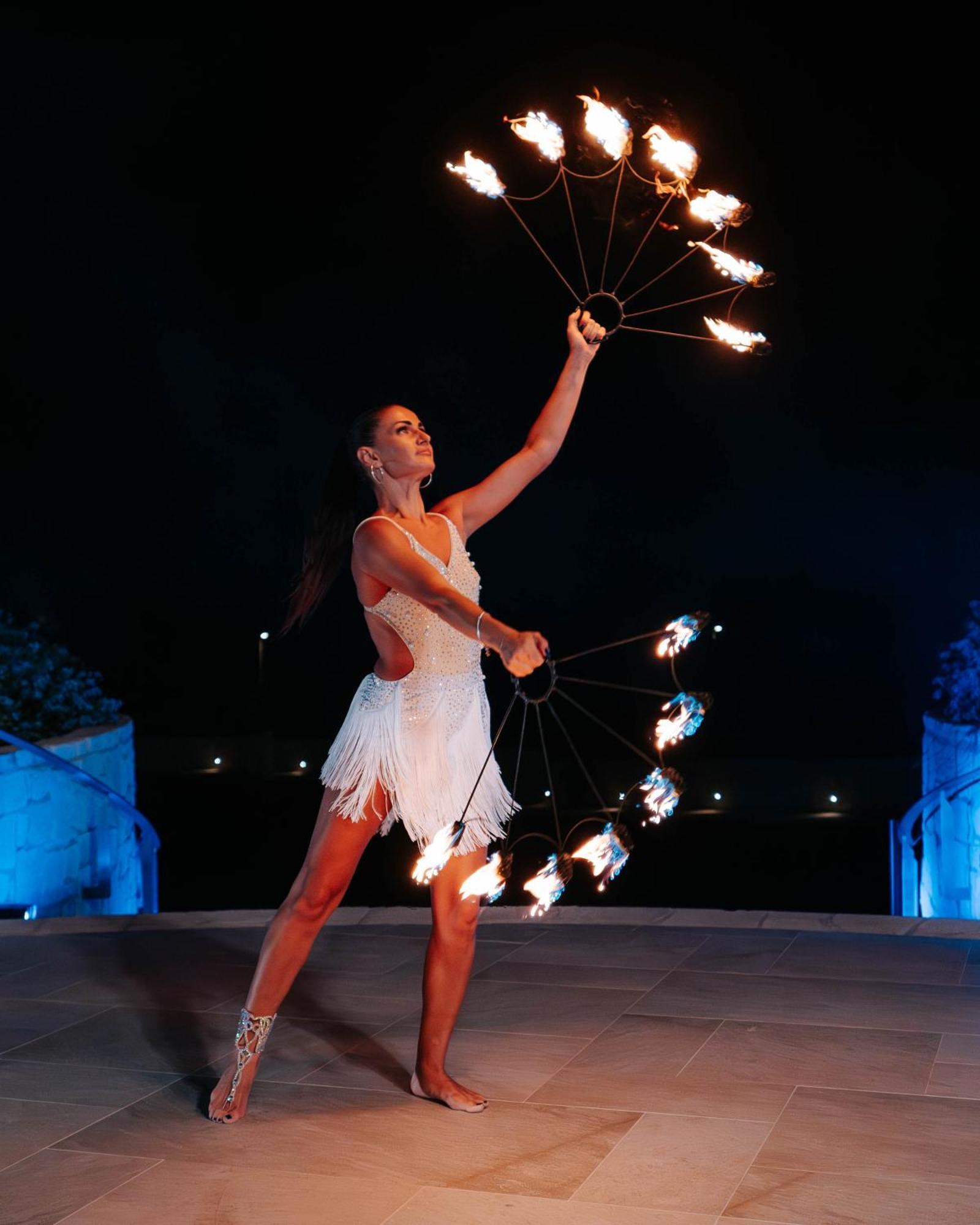 City Of Dreams Mediterranean - Integrated Resort, Casino & Entertainment Limassol Kültér fotó A woman performing with a fire fan